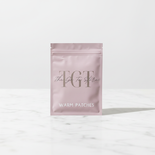 TGT Heat Therapy Patch Single on white marble surface – premium product photography
