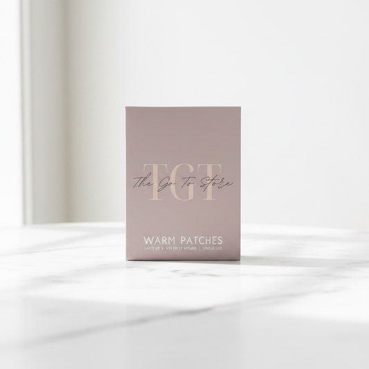 TGT Heat Therapy Patches Box of 4 on white marble surface – premium product photography
